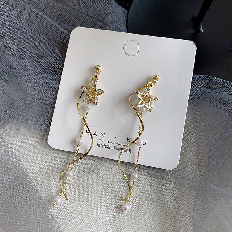 Boucle d'oreille étoile avec perles