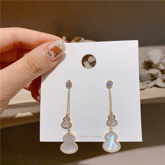 Boucles d’oreilles en forme de calebasse