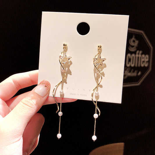 Boucle d'oreille étoile avec perles